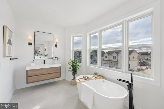 bathroom featuring a tub and vanity