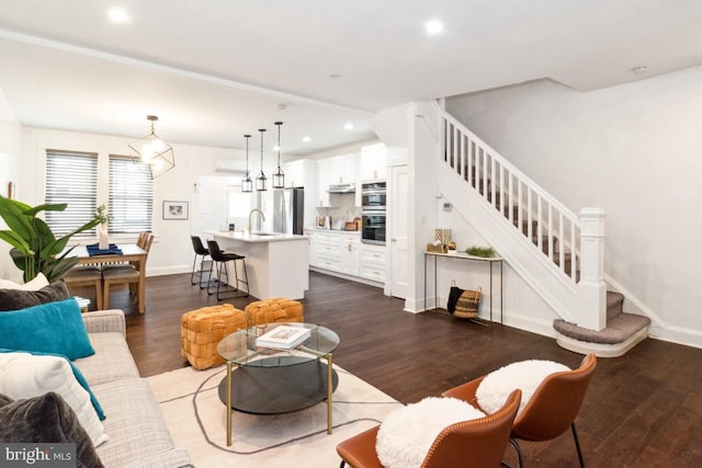 living room featuring dark hardwood / wood-style flooring