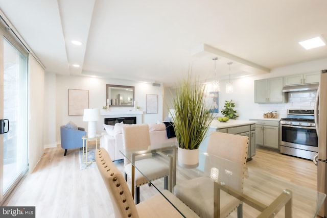 dining space featuring light hardwood / wood-style flooring