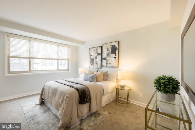 bedroom featuring light colored carpet