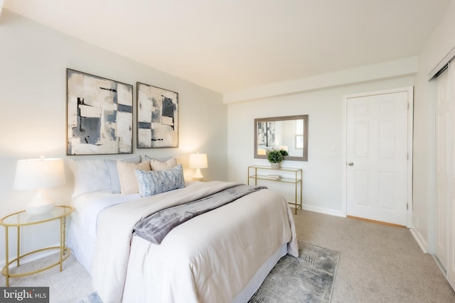 carpeted bedroom with a closet