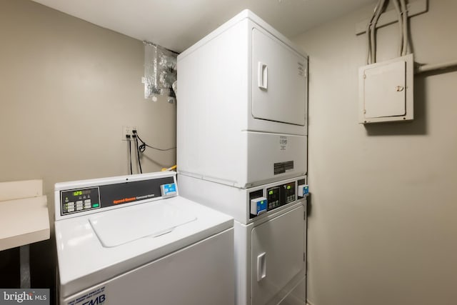 washroom featuring stacked washer / drying machine, independent washer and dryer, and electric panel