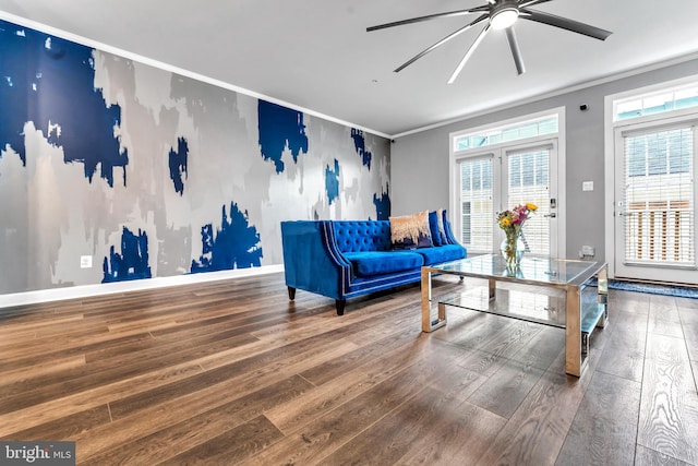 interior space featuring hardwood / wood-style floors, ceiling fan, and crown molding