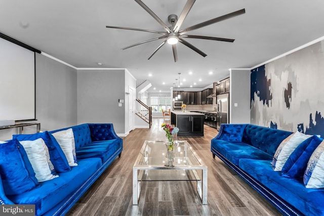 living room featuring crown molding, ceiling fan, and dark hardwood / wood-style floors