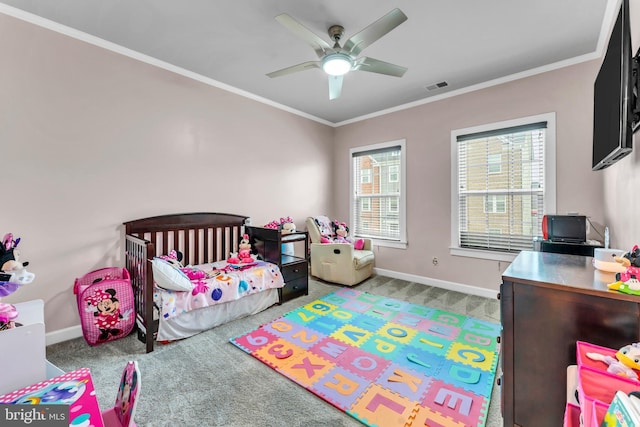 carpeted bedroom featuring ceiling fan and ornamental molding