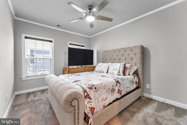 carpeted bedroom featuring ceiling fan and crown molding