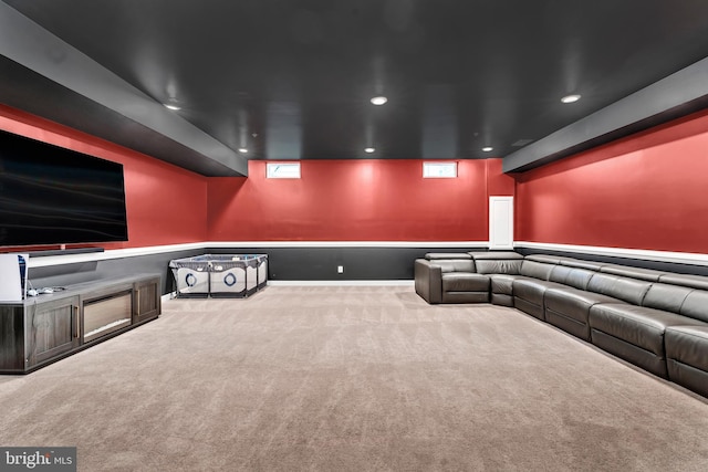 home theater room featuring light carpet