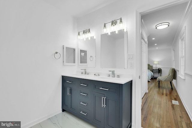 bathroom featuring vanity and crown molding