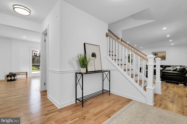 stairway featuring wood-type flooring