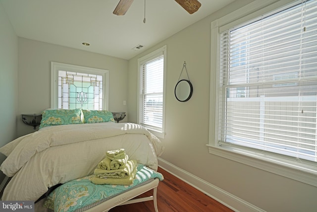 bedroom featuring dark hardwood / wood-style flooring and ceiling fan