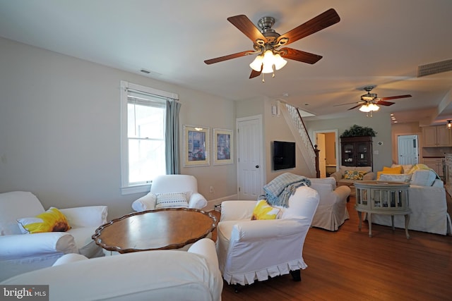 living room with hardwood / wood-style flooring and ceiling fan