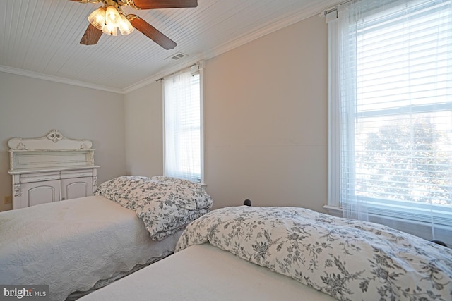 bedroom featuring crown molding and ceiling fan