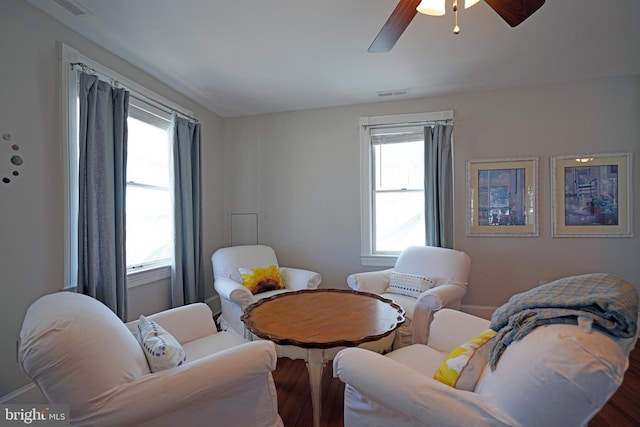 sitting room featuring hardwood / wood-style flooring and ceiling fan