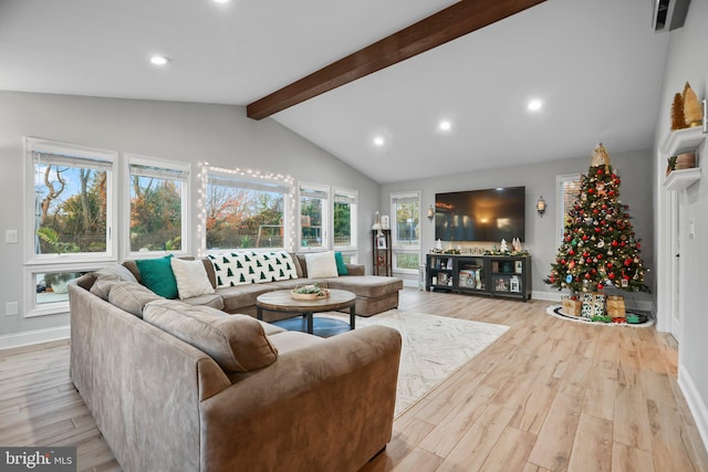 living room featuring light wood-type flooring and lofted ceiling with beams