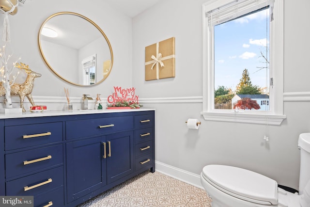 bathroom with tile patterned floors, vanity, and toilet