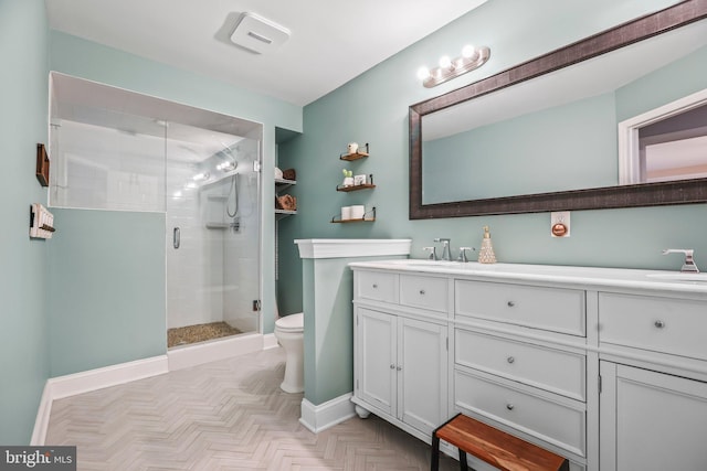 bathroom featuring vanity, toilet, parquet floors, and a shower with door