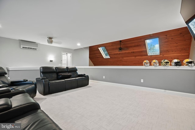 carpeted cinema room featuring an AC wall unit and wood walls