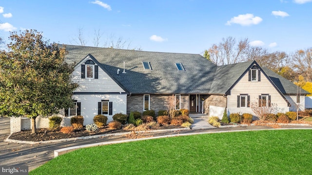 view of front of property with a front lawn