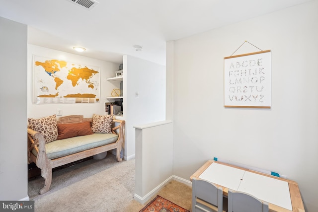 sitting room featuring carpet