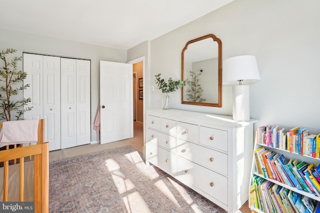 carpeted bedroom with a closet