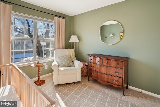 sitting room featuring light carpet