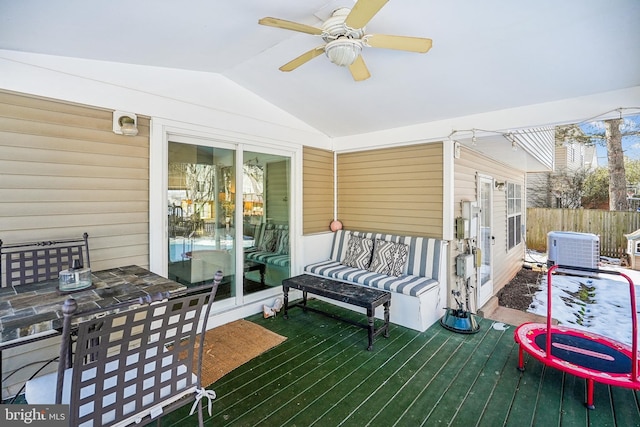 wooden deck with central air condition unit and ceiling fan