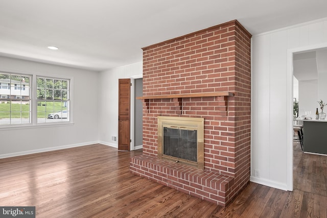 unfurnished living room featuring dark hardwood / wood-style floors and a fireplace