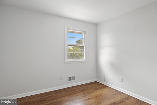 empty room featuring hardwood / wood-style flooring