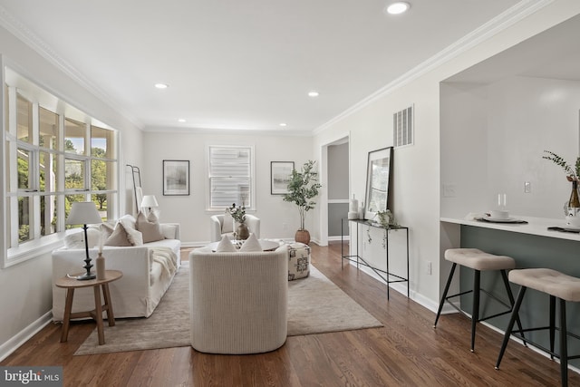 living room with dark hardwood / wood-style floors and ornamental molding