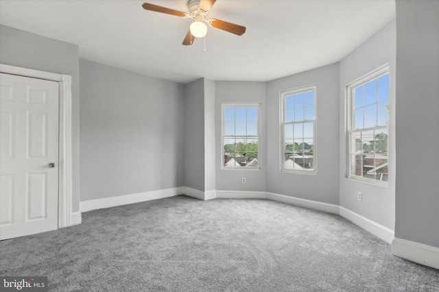 unfurnished room featuring carpet flooring and ceiling fan