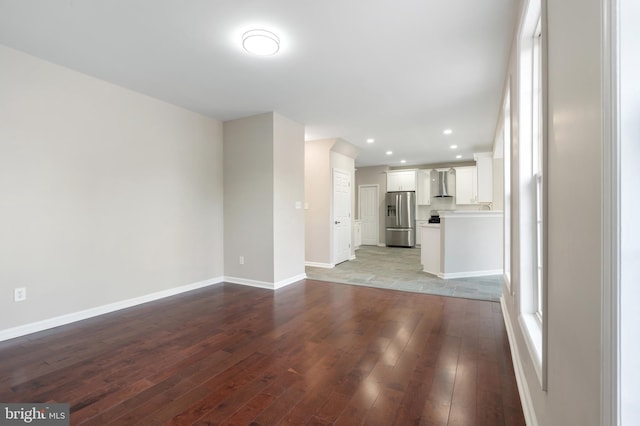 unfurnished living room with light hardwood / wood-style flooring