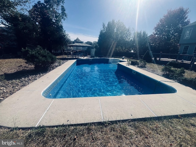 view of swimming pool with a gazebo