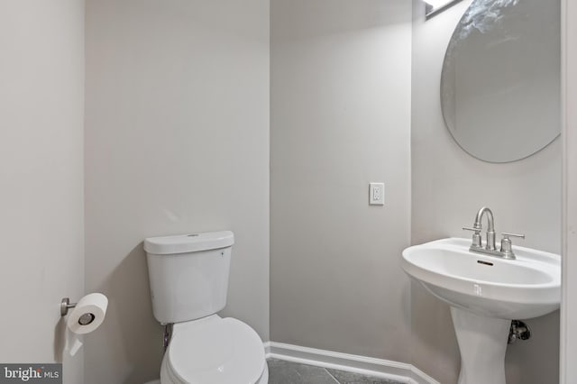 bathroom with tile patterned floors, sink, and toilet