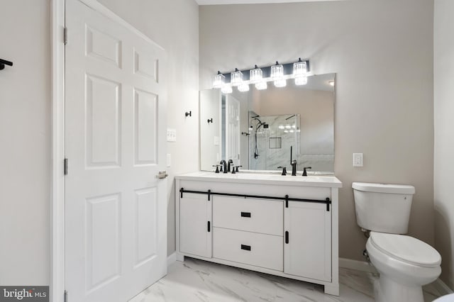 bathroom featuring a shower with door, vanity, and toilet