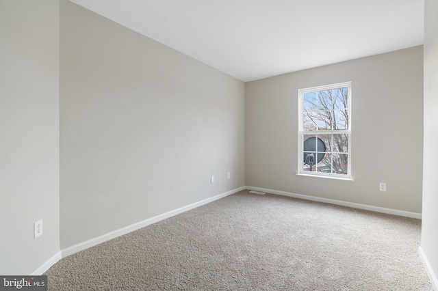 unfurnished room featuring carpet floors