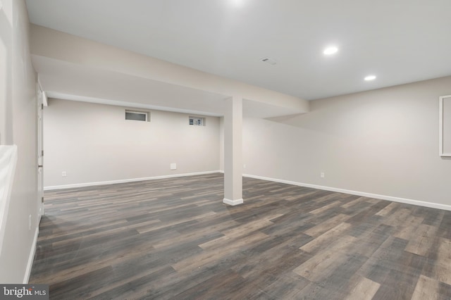 basement with dark wood-type flooring