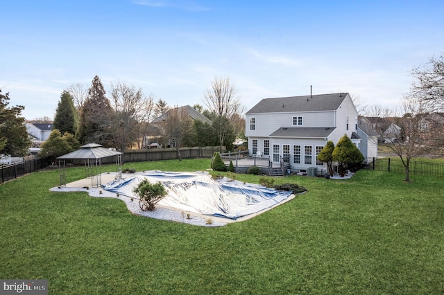 exterior space featuring a gazebo, a yard, and a deck