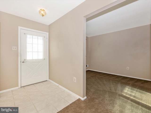 foyer featuring light tile patterned floors