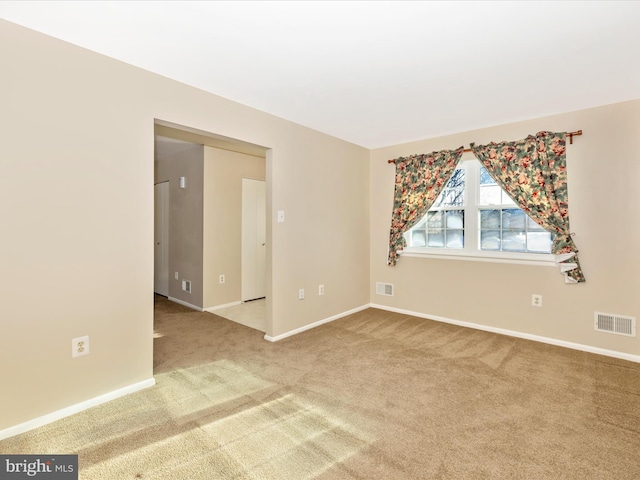 unfurnished room featuring carpet floors