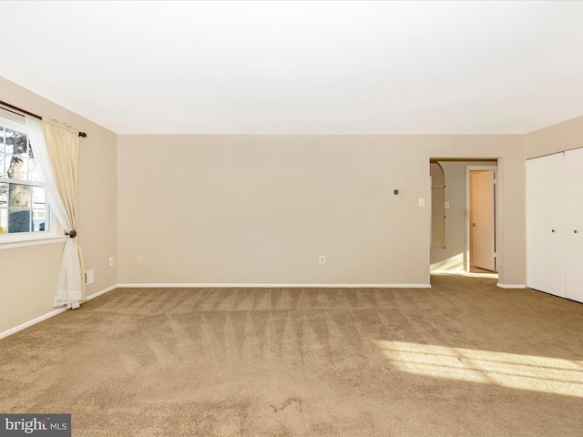 empty room featuring carpet flooring