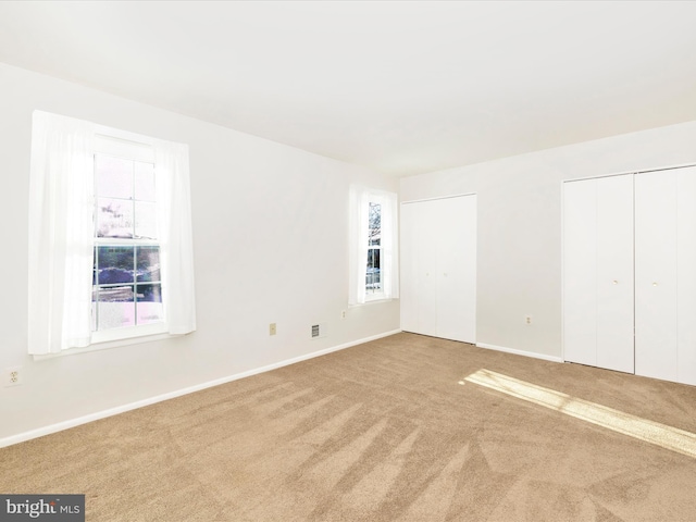 empty room featuring carpet flooring