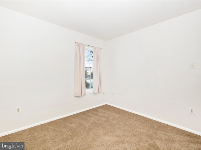 empty room featuring carpet floors