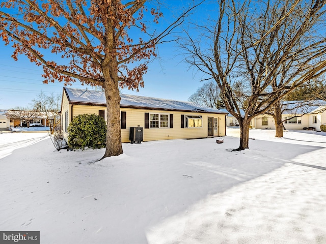 single story home featuring central air condition unit