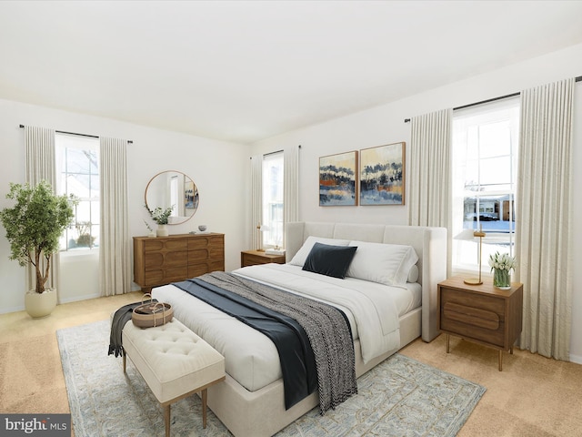 bedroom with light colored carpet