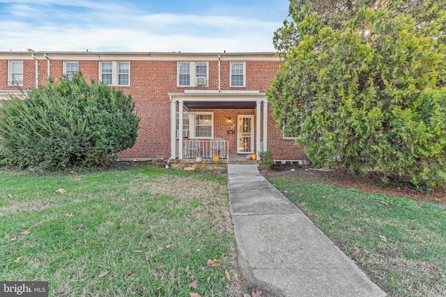 3309 Woodstock Ave, Baltimore, MD 21213 - multi unit property with a front yard and covered porch