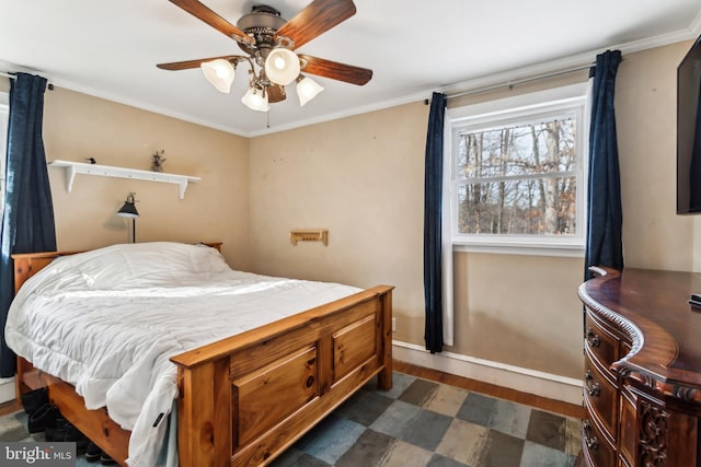 bedroom featuring dark wood-type flooring, ornamental molding, and ceiling fan