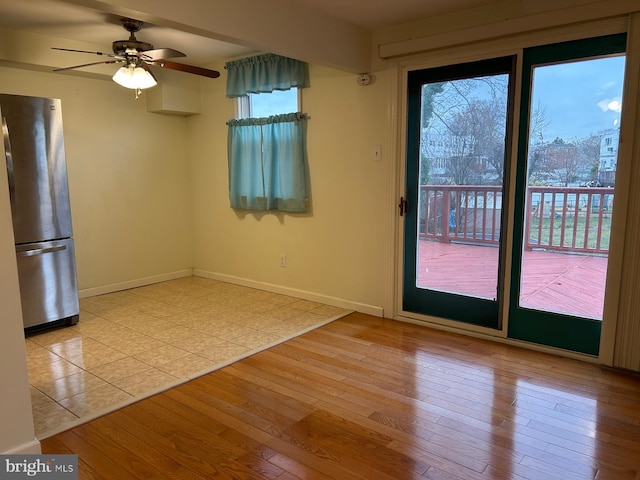 interior space featuring ceiling fan and light wood-type flooring