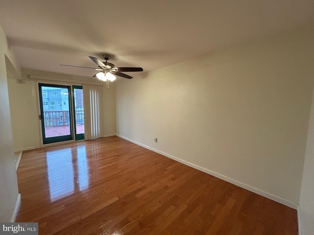 unfurnished room with hardwood / wood-style flooring and ceiling fan