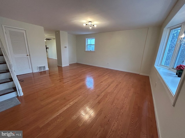 empty room with wood-type flooring