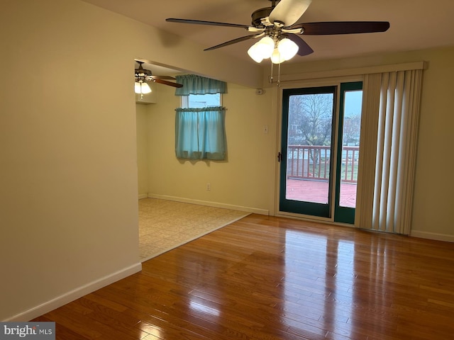 spare room featuring ceiling fan and light wood-type flooring